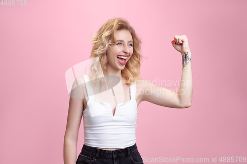 Image of Caucasian young woman\'s portrait isolated on pink studio background. Beautiful female model. Concept of human emotions, facial expression, sales, ad, youth culture.