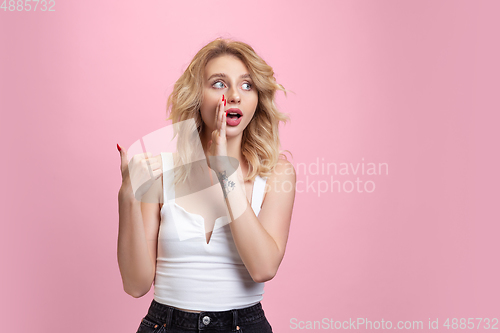 Image of Caucasian young woman\'s portrait isolated on pink studio background. Beautiful female model. Concept of human emotions, facial expression, sales, ad, youth culture.