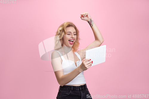 Image of Caucasian young woman\'s portrait isolated on pink studio background. Beautiful female model. Concept of human emotions, facial expression, sales, ad, youth culture.