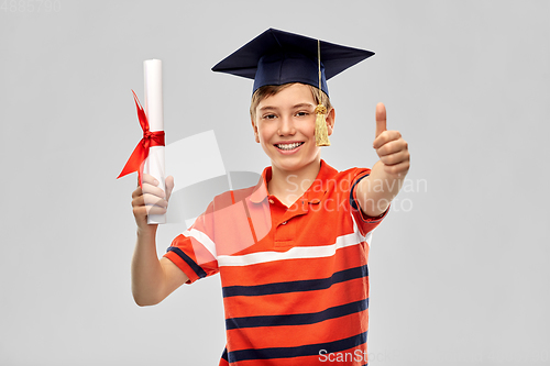 Image of graduate student boy in mortarboard with diploma