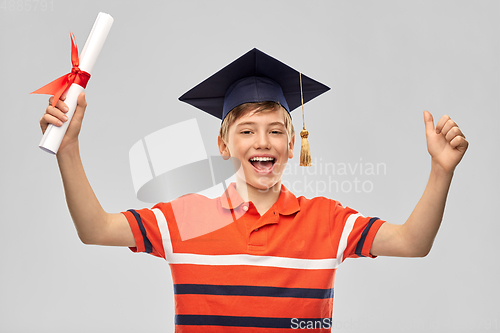 Image of graduate student boy in mortarboard with diploma