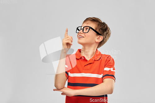 Image of portrait of happy smiling boy in eyeglasses