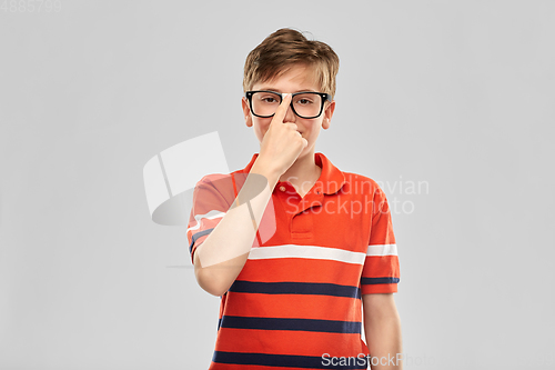 Image of portrait of happy smiling boy in eyeglasses