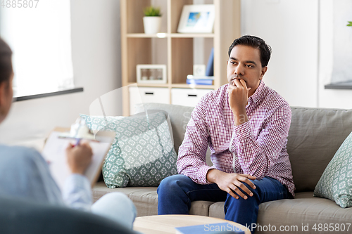Image of man and psychologist at psychotherapy session