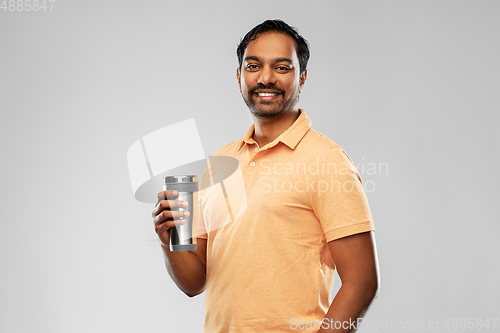 Image of indian man with thermo cup or tumbler for drink