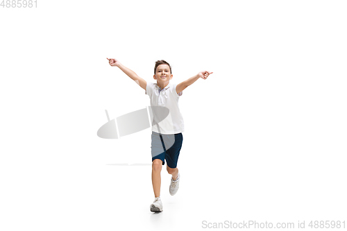 Image of Happy little caucasian boy jumping and running isolated on white background