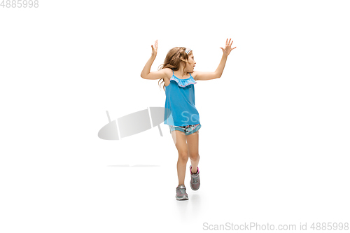 Image of Happy little caucasian girl jumping and running isolated on white background