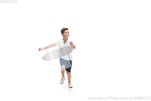 Image of Happy little caucasian boy jumping and running isolated on white background