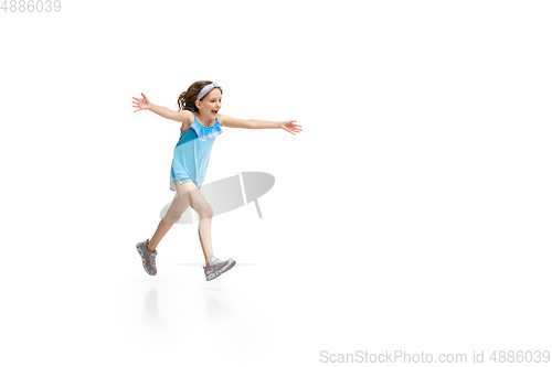 Image of Happy little caucasian girl jumping and running isolated on white background