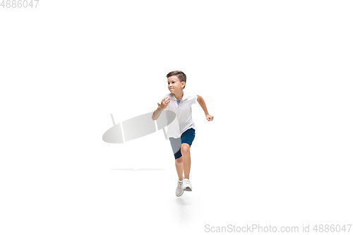 Image of Happy little caucasian boy jumping and running isolated on white background