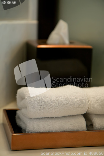 Image of pile of towels in a hotel bathroom
