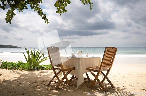 Image of table and chairs on a beach