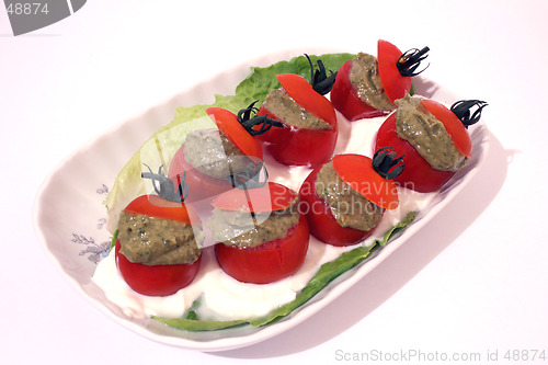 Image of tomatoes filled with avocado