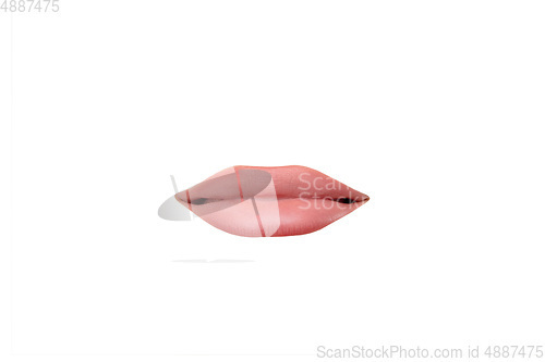 Image of Close up view of female mouth wearing nude lipstick isolated over white studio background