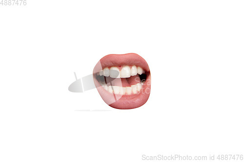 Image of Close up view of female mouth wearing nude lipstick isolated over white studio background