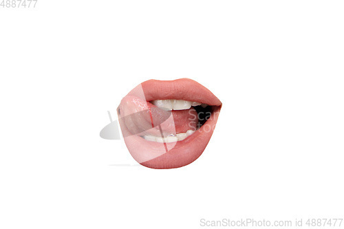 Image of Close up view of female mouth wearing nude lipstick isolated over white studio background