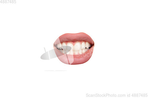 Image of Close up view of female mouth wearing nude lipstick isolated over white studio background