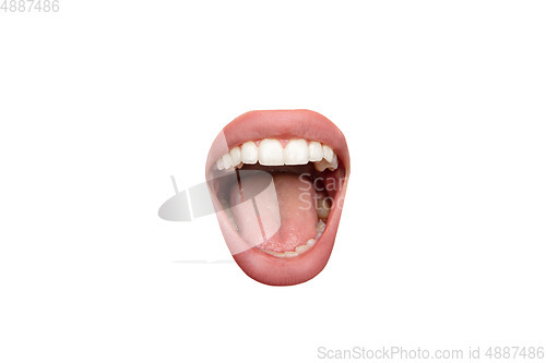 Image of Close up view of female mouth wearing nude lipstick isolated over white studio background