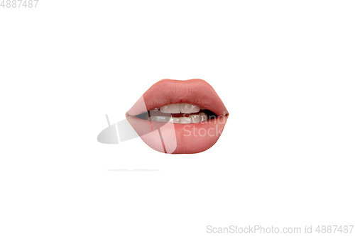 Image of Close up view of female mouth wearing nude lipstick isolated over white studio background