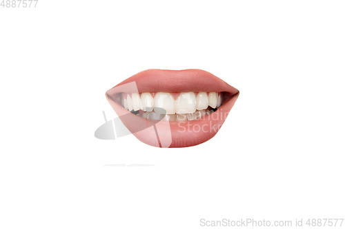 Image of Close up view of female mouth wearing nude lipstick isolated over white studio background