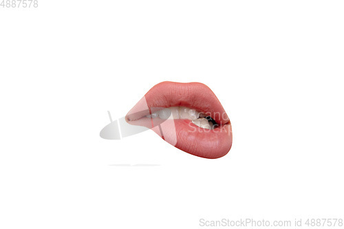 Image of Close up view of female mouth wearing nude lipstick isolated over white studio background