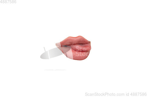 Image of Close up view of female mouth wearing nude lipstick isolated over white studio background