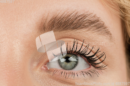 Image of Close up of face of beautiful caucasian young woman, focus on eyes