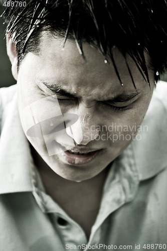 Image of Sad and depressed young asian man