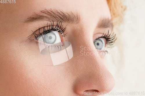 Image of Close up of face of beautiful caucasian young woman, focus on eyes