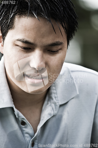 Image of Sad young asian male