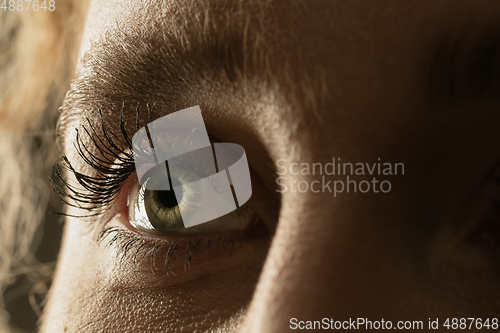 Image of Close up of face of beautiful caucasian young woman, focus on eyes