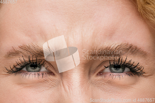 Image of Close up of face of beautiful caucasian young woman, focus on eyes