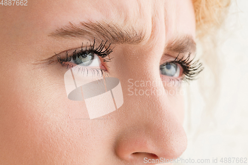 Image of Close up of face of beautiful caucasian young woman, focus on eyes