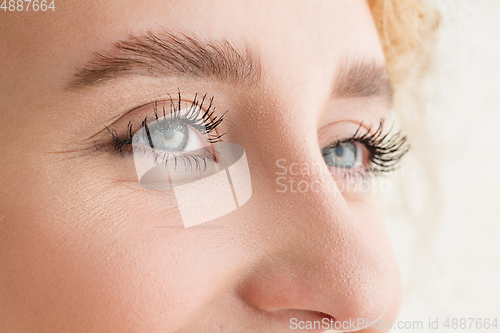 Image of Close up of face of beautiful caucasian young woman, focus on eyes