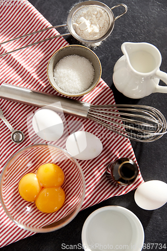 Image of whisk, eggs, sugar, milk, flour and vanilla