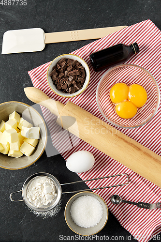 Image of rolling pin, butter, eggs, flour and chocolate