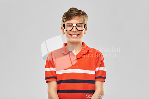 Image of portrait of happy smiling boy in eyeglasses