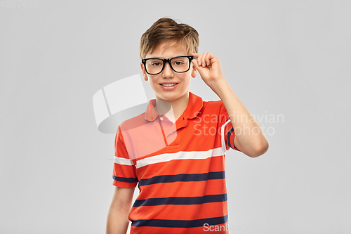 Image of portrait of happy smiling boy in eyeglasses