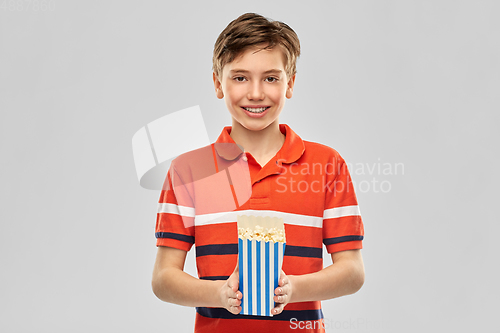 Image of smiling boy eating popcorn