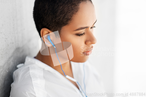 Image of african american woman with earphones