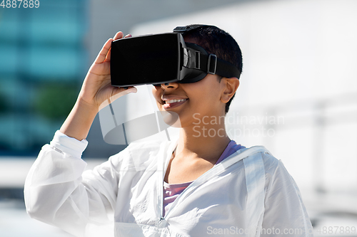 Image of happy african american woman with vr glasses