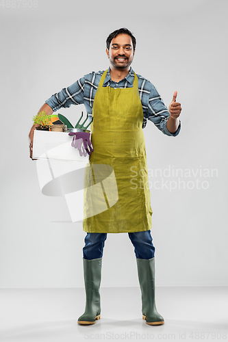 Image of indian gardener or farmer with box of garden tools