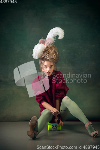 Image of Young woman as Marie Antoinette on dark background. Retro style, comparison of eras concept.