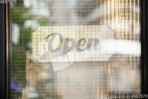 Image of Open sign on the glass of street cafe or restaurant