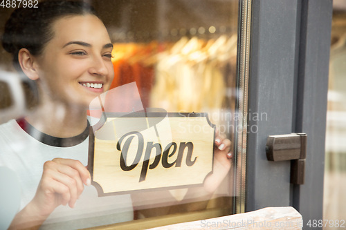 Image of Open sign on the glass of street cafe or restaurant