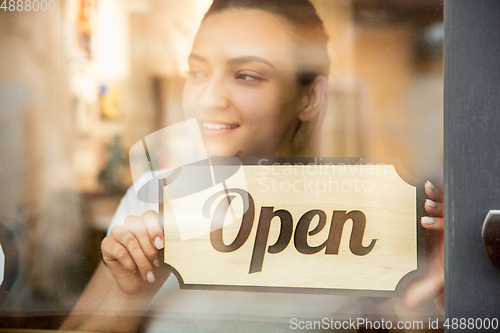 Image of Open sign on the glass of street cafe or restaurant