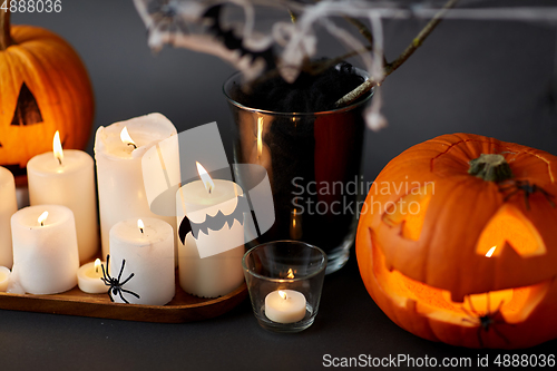 Image of pumpkins, candles and halloween decorations