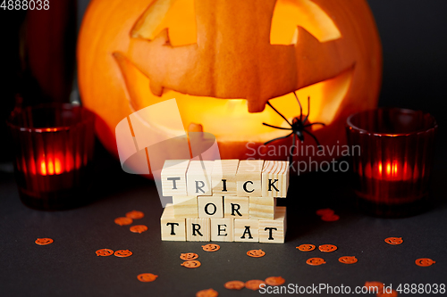 Image of toy blocks with trick or treat words on halloween