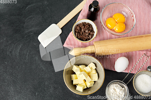 Image of rolling pin, butter, eggs, flour and chocolate