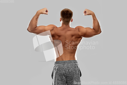 Image of young man or bodybuilder with bare torso